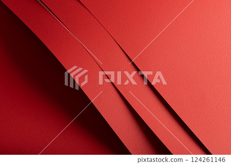 Bright red paper background with a matte texture and rough grain. Vibrant, bold tones create an 124261146