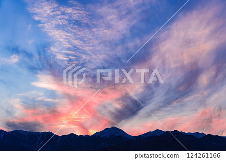 Evening mountain scenery with a mysterious sky color Evening mountain scenery with a mysterious sky color 124261166