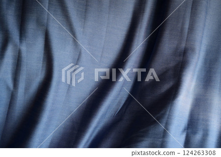 Wrinkled blue sheets 124263308