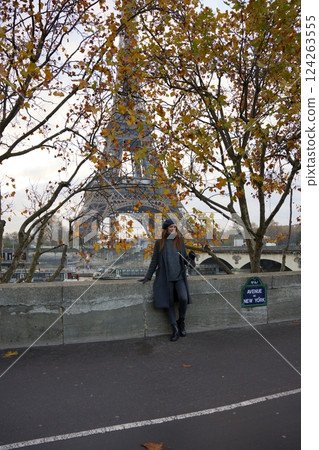 Chic Parisian Woman in Beret Poses Near Avenue De New York and Eiffel Tower 124263555