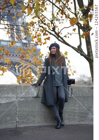Stylish Autumn Woman in Coat and Beret by Eiffel Tower and Avenue De New York 124263567