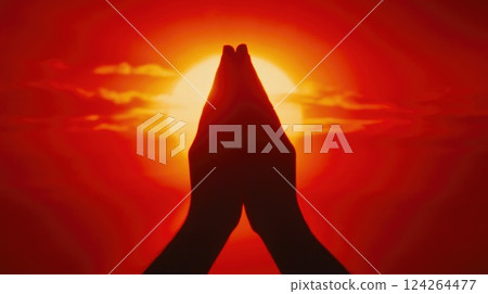 Silhouette of Praying Hands at Sunset 124264477