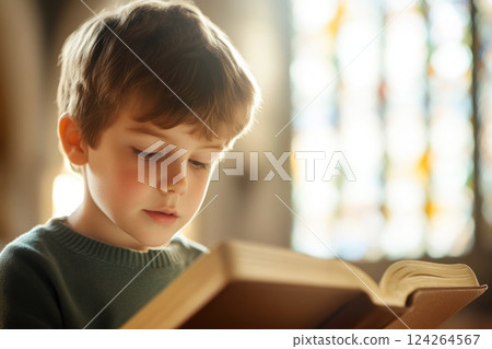 Innocent Child Engaged in Bible Reading at Church 124264567