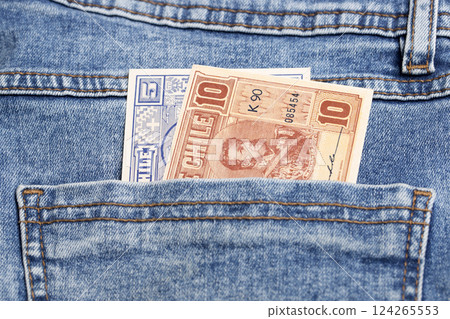 Old Chilean Peso in the pocket of blue jeans 124265553
