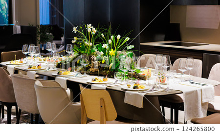 Elegant table decor for luxury dining with floral centerpieces Elegant table decor for luxury dining with floral centerpieces 124265800