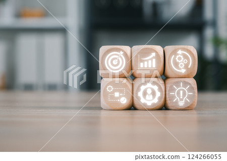 Wooden blocks with icons symbolize business process management, showcasing strategy, innovation, and workflow optimization. 124266055