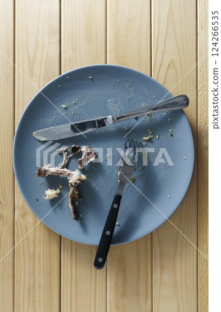 Dirty plate with leftover food Dirty plate with leftover food 124266535