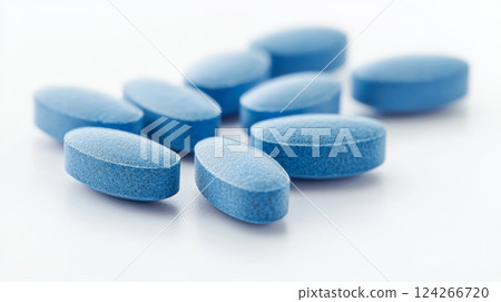 A close-up of a single blue vitamin tablet set against a clean white background. Generative AI 124266720