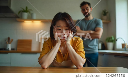 portrait of stressed woman and her husband on background, argument, dysfunctional relationships 124267158