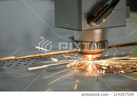 The fiber laser cutting machine cut the metal plate with the sparkling light. The fiber laser cutting machine cut the metal plate with the sparkling light. 124267509