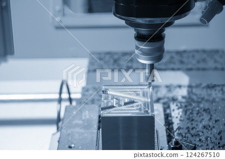 The CNC milling machine rough cutting the mold parts by indexable tools in the light blue scene. 124267510
