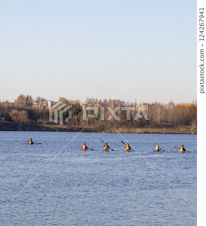 Group of people kayaking on the open water 124267941