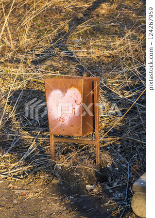 Outdoor trash bin with heart painted on it 124267959