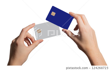 Credit card comparison, woman holding two blank cards with chip. Closeup of arm, wrist with debit 124268723