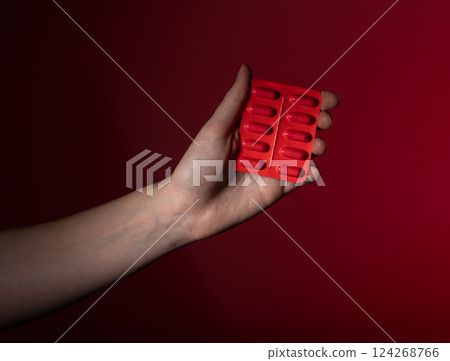 Woman holding pill in hand, pharmaceutical medication for health and treatment. Prescription drug, 124268766