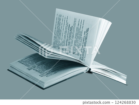 Open book, pages flipping at a tilted angle, on blue monochrome background. Modern hardcover, Open book, pages flipping at a tilted angle, on blue monochrome background. Modern hardcover, 124268830