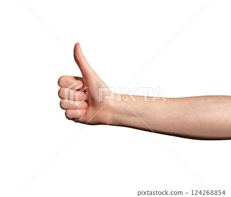 Hand showing thumbs-up gesture. Caucasian female expressing approval, success, and positivity. Light Hand showing thumbs-up gesture. Caucasian female expressing approval, success, and positivity. Light 124268854