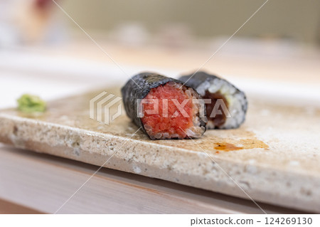 Two hosomaki sushi rolls with finely chopped tuna and dried calabash filling wrapped in nori Two hosomaki sushi rolls with finely chopped tuna and dried calabash filling wrapped in nori 124269130