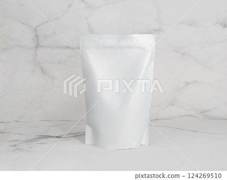 White zipper bag on marble background. Blank packaging white zipper pouch on white marble background ready for food product packaging design mock-up White zipper bag on marble background. Blank packaging white zipper pouch on white marble background ready for food product packaging design mock-up 124269510