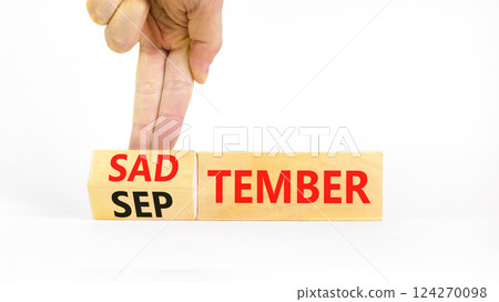 September is Sadtember symbol. Concept words September is Sadtember on beautiful wooden blocks. Beautiful white background. Businessman hand. Business September is Sadtember concept. Copy space. 124270098