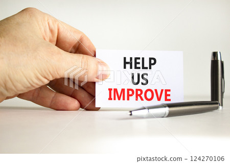 Help us improve symbol. Concept words Help us improve on beautiful white card. Beautiful white background. Businessman hand. Business motivational help us improve concept. Copy space. Help us improve symbol. Concept words Help us improve on beautiful white card. Beautiful white background. Businessman hand. Business motivational help us improve concept. Copy space. 124270106