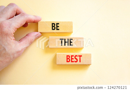 Motivational be the best symbol. Concept words Be the best on beautiful wooden blocks. Beautiful white background. Businessman hand. Business motivational be the best concept. Copy space. Motivational be the best symbol. Concept words Be the best on beautiful wooden blocks. Beautiful white background. Businessman hand. Business motivational be the best concept. Copy space. 124270121