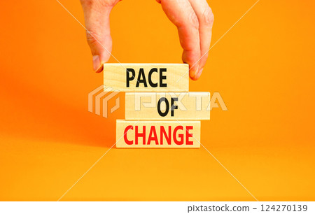 Pace of change symbol. Concept words Pace of change on beautiful wooden blocks. Beautiful orange background. Businessman hand. Business pace of change concept. Copy space. Pace of change symbol. Concept words Pace of change on beautiful wooden blocks. Beautiful orange background. Businessman hand. Business pace of change concept. Copy space. 124270139
