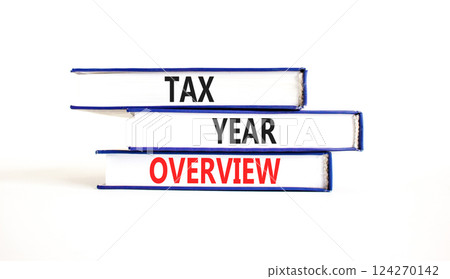 Tax year overview symbol. Concept words Tax year overview on beautiful blue white books. Beautiful white background. Business tax year overview concept. Copy space. Tax year overview symbol. Concept words Tax year overview on beautiful blue white books. Beautiful white background. Business tax year overview concept. Copy space. 124270142