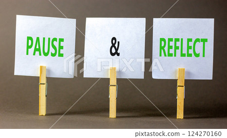 Pause and reflect symbol. Concept words Pause and reflect on beautiful white paper on clothespin. Beautiful grey background. Business motivational lifestyle pause and reflect concept. Copy space. Pause and reflect symbol. Concept words Pause and reflect on beautiful white paper on clothespin. Beautiful grey background. Business motivational lifestyle pause and reflect concept. Copy space. 124270160