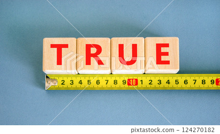 True symbol. Concept word True on beautiful wooden blocks. Beautiful yellow ruler. Beautiful blue table blue background. Business, lifestyle, support and true concept. Copy space. True symbol. Concept word True on beautiful wooden blocks. Beautiful yellow ruler. Beautiful blue table blue background. Business, lifestyle, support and true concept. Copy space. 124270182