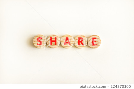 Share symbol. Concept word Share on beautiful wooden circles. Beautiful white table white background. Business lifestyle share concept. Copy space. 124270300