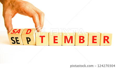 September is Sadtember symbol. Concept words September is Sadtember on beautiful wooden blocks. Beautiful white background. Businessman hand. Business September is Sadtember concept. Copy space. 124270304