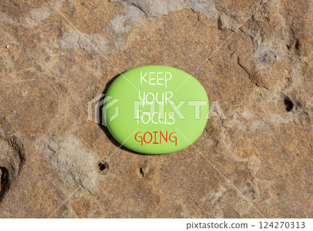 Keep your focus going symbol. Concept words Keep your focus going on beautiful green stone. Beautiful stone background. Business and keep your focus going concept. Copy space Keep your focus going symbol. Concept words Keep your focus going on beautiful green stone. Beautiful stone background. Business and keep your focus going concept. Copy space 124270313
