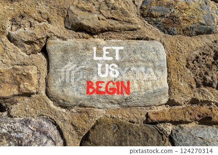 Let us begin symbol. Concept words Let us begin on beautiful grey stone on stone wall. Beautiful stone wall background. Business motivational let us begin concept. Copy space. 124270314