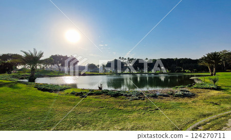 Big green golf park in Cairo, Egypt. Palms on the background  124270711