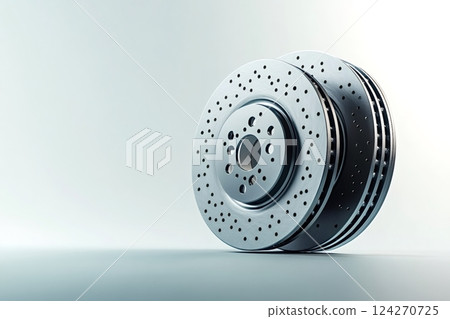 Car brake discs showing holes and slots for better braking performance 124270725