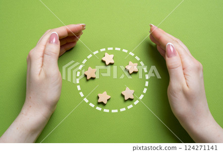 Hands guard the stars in the circle. Team members and organization members. Teamwork, unity, and organizational support. Collaboration, member protection, and collective responsibility 124271141