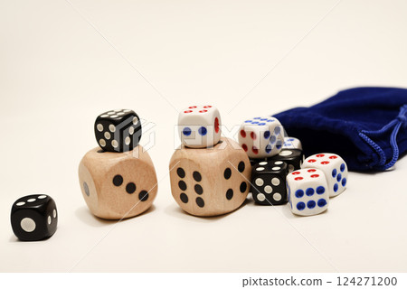 Dice on a white background. Large and small dice. Dice on a white background. Large and small dice. 124271200