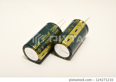 Electrolytic capacitors on a white background. Electronic elements for electronic devices. Electrolytic capacitors on a white background. Electronic elements for electronic devices. 124271210