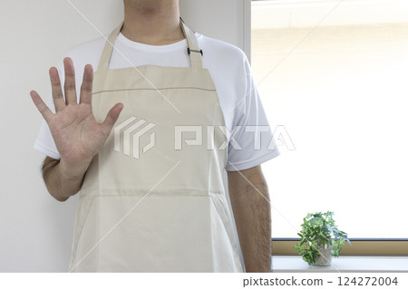 Man wearing an apron waving (faceless, Japanese, 30s) Man wearing an apron waving (faceless, Japanese, 30s) 124272004