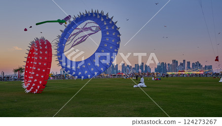 Qatar Kite Festival 2025 in Old Doha port (Mina District) sunset shot showing spectacular showcase of colorful kites soaring across the Doha skyline Qatar Kite Festival 2025 in Old Doha port (Mina District) sunset shot showing spectacular showcase of colorful kites soaring across the Doha skyline 124273267