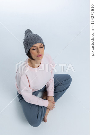 Close-up of hat element. Beautiful knitting with original hole. Studio photography. Vertical photo. High quality photo Close-up of hat element. Beautiful knitting with original hole. Studio photography. Vertical photo. High quality photo 124273610