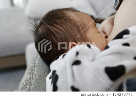 Breastfeeding mother and newborn baby 124273775