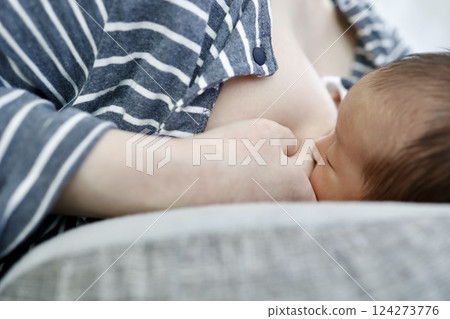 Breastfeeding mother and newborn baby 124273776
