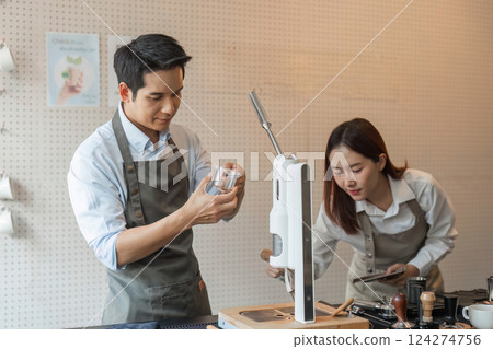Sustainable Coffee Practices and Barista Collaboration. Two baristas engaging in sustainable coffee preparation using eco-friendly tools and techniques. Sustainable Coffee Practices and Barista Collaboration. Two baristas engaging in sustainable coffee preparation using eco-friendly tools and techniques. 124274756