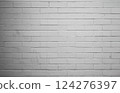 A white brick wall as a background with and  a softly shaded, old. 124276397