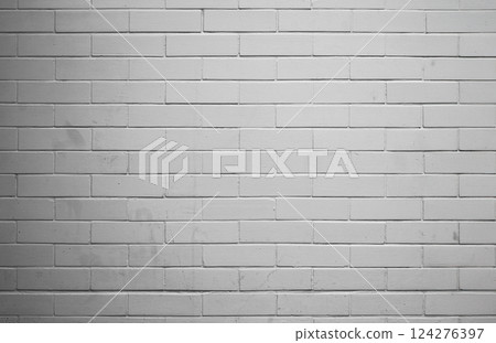 A white brick wall as a background with and a softly shaded, old. A white brick wall as a background with and a softly shaded, old. 124276397