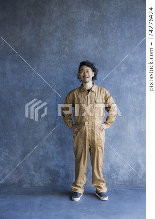 Man in overalls 124276424