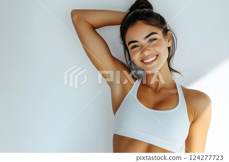Healthy smiling woman in white sportswear 124277723