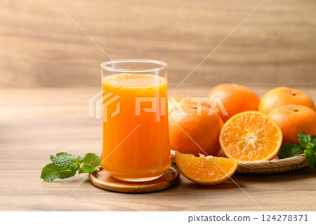 Glass of orange juice and fresh orange fruit on wooden background, Healthy drink Glass of orange juice and fresh orange fruit on wooden background, Healthy drink 124278371